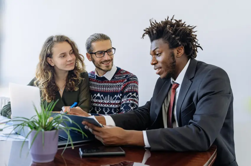 man-in-black-suit-jacket-sitting-beside-woman-in-brown-and-black-long-sleeve-shirt